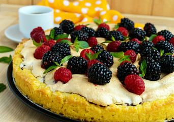 Pie (Tart) with fresh blackberries and raspberries, air meringue, decorative mint. Close up