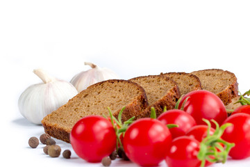 Composition of bread, bunch of cherry tomatoes and garlic