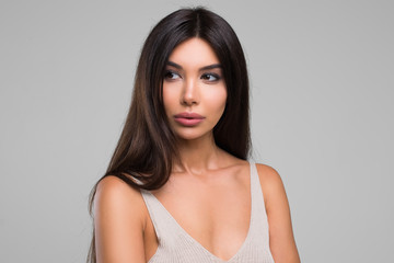 Fototapeta premium Beautiful Woman With Perfect Skin and Long Hair Beauty Studio Portrait