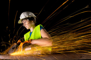 girl working with angle grinder