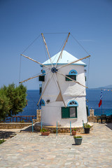 Fototapeta na wymiar traditional old windmill on Skinari Cape, Zakynthos island, Greece