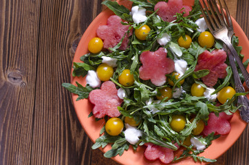 Arugula salad with cherry tomatoes cream cheese and watermelon  