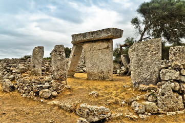Stormy clouds over ancient megalith, Minorca