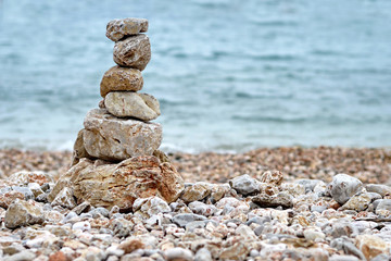 Fototapeta na wymiar Stack of stones on the beach