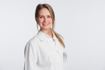 Medical doctor woman standing isolated on white background. Looking at camera