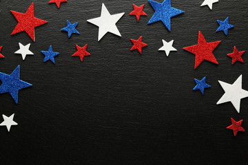 Red, white, and blue stars on slate background