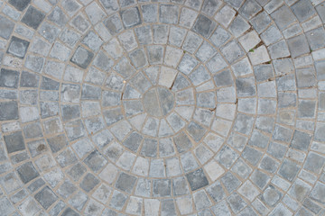 Cobble circular pattern block pavement texture background. Top view