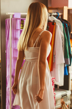 Fashionable girl in cloakroom.