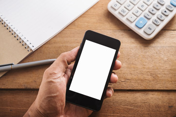 Hand of young man and mobile phone