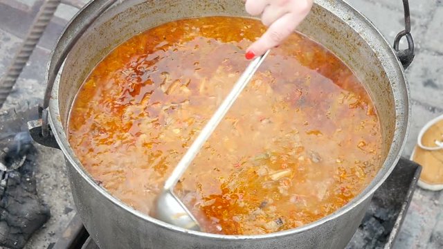 borsch in big cauldron, close up, slow motion