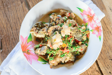 Stir-fried frog and basil  on wooden