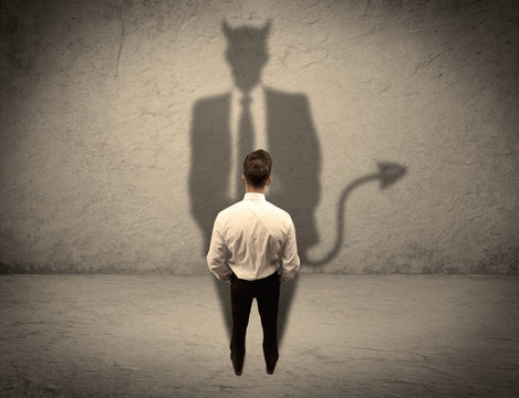 Salesman facing his own devil shadow