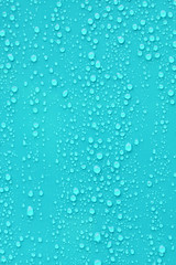 Close up water drop on blue background.