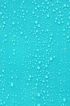 Close up water drop on blue background.