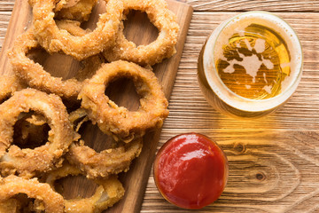 Traditional fastfood - onion rings with beer