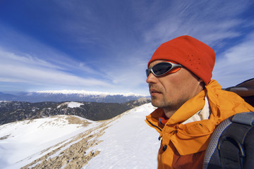 Winter hiking in the mountains with a backpack. © Bondariev Volodymyr.