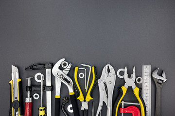 different tools and instruments for home renovation on grey desk