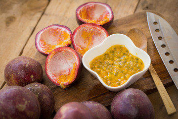 Fresh passion fruits on a wooden background