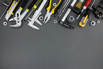 house renovation tools and accessories on dark grey background