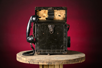 Old military field phone isolated