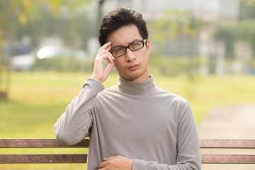 Man feel confused at park