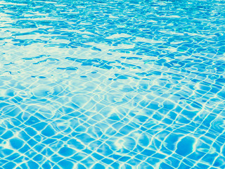 Fototapeta na wymiar Blue wave ripped water in swimming pool