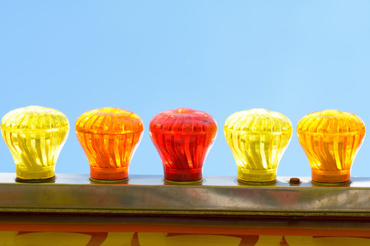 Bright colourful glass light bulbs on Big Wheel fun fair ride