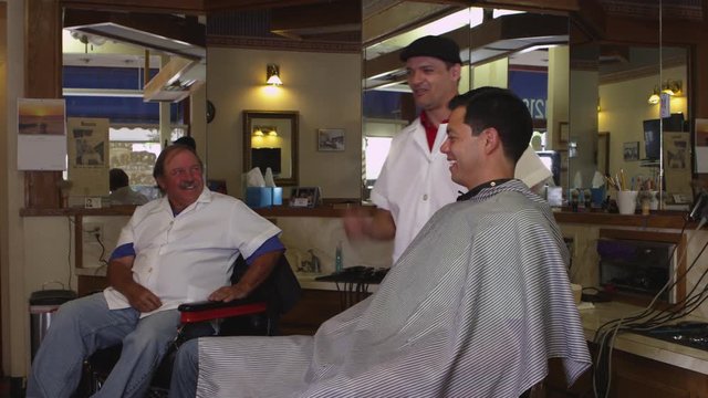 Man getting haircut at barber shop