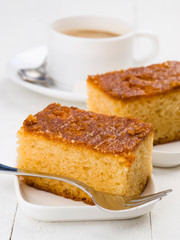 sweet cake with coffee on table