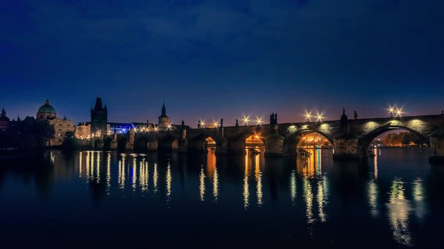 Czech Republic. Prague. Charles bridge on the Vltava river. Early on a gloomy autumn morning. Time lapse UHD