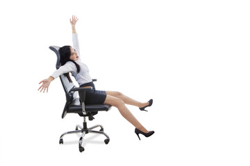 Happy female worker sits on office chair