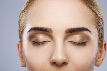 Portrait of girl with nude make up at studio