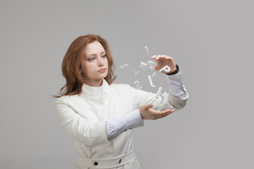 Woman working with a set of letters, writing concept.