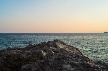 Fototapeta na wymiar Sea and rocks at sunset