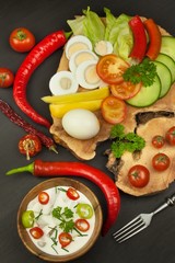 Fresh vegetables for snacks with dressing. Dip for vegetables. Healthy diet meal for dinner. Preparing vegetables in a home kitchen.
