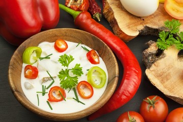 Fresh vegetables for snacks with dressing. Dip for vegetables. Healthy diet meal for dinner. Preparing vegetables in a home kitchen.
