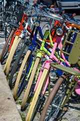 Colored bicycles parked in a european street.