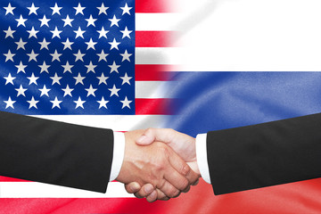 businessman shakehand over half america half russian flag