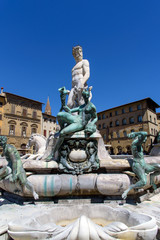 Fototapeta na wymiar fountain of Neptune in Piazza della Signoria, Florence, italy