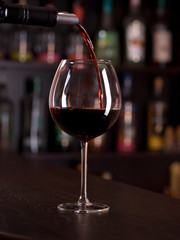 Pouring red wine