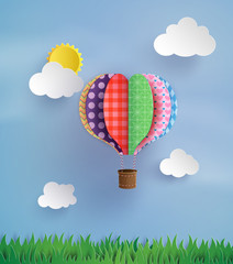 Naklejka premium Colorful Patchwork Hot Air Balloon in the Sky