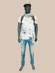 Male mannequin dressed in t-shirt and jeans.