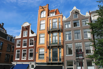 Fototapeta na wymiar Houses in the classic Dutch style in Amsterdam, the Netherlands