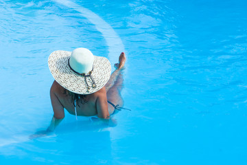 Beautiful woman at a pool