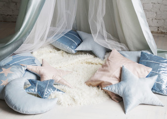 Wigwam with different pillows © Sunny