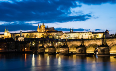 Prague Castle with charle's bridge in twilight with dramatic sky