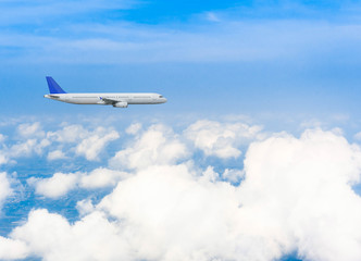 Naklejka na ściany i meble Airplane with background of cloudy sky, exploration conceptual