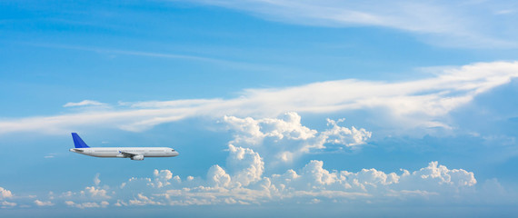 Airplane with background of cloudy sky, exploration conceptual