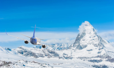 Fototapeta na wymiar Airplane with background of Matterhorn snow mountain, exploratio