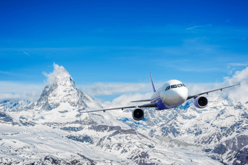 Fototapeta na wymiar Airplane with background of Matterhorn snow mountain, exploratio